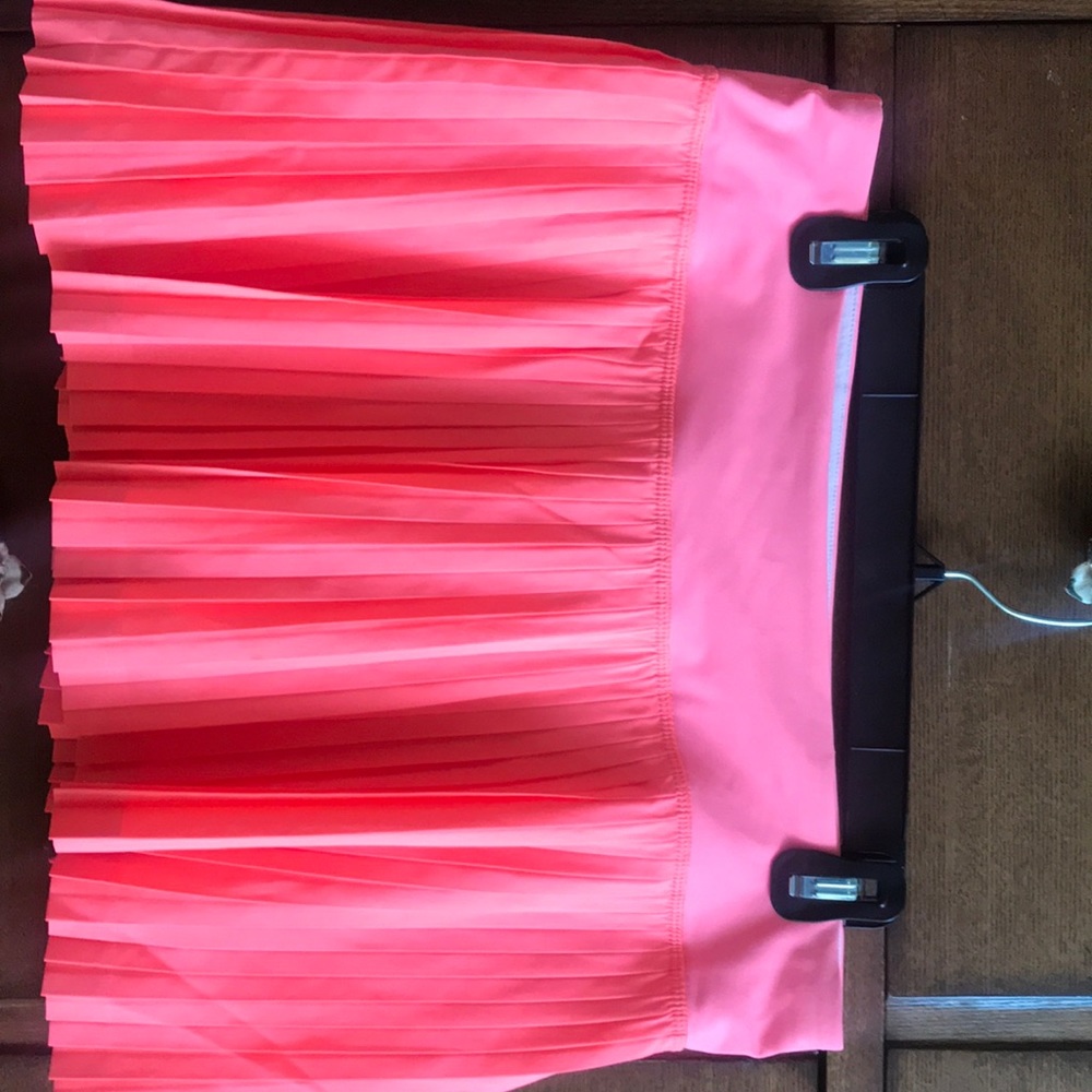 Bright orange tennis skirt